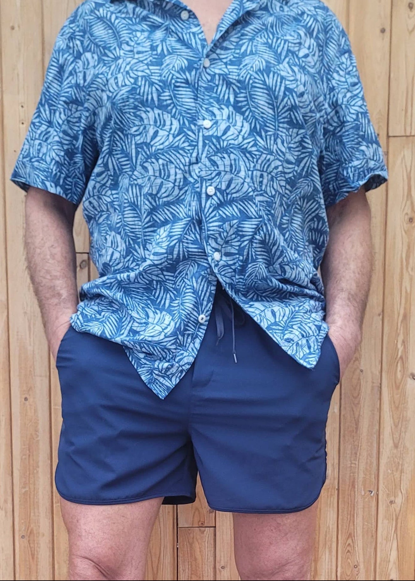 man in Jasikini  blue swim shorts and a blue dress shirt - Jasikini swimwear
