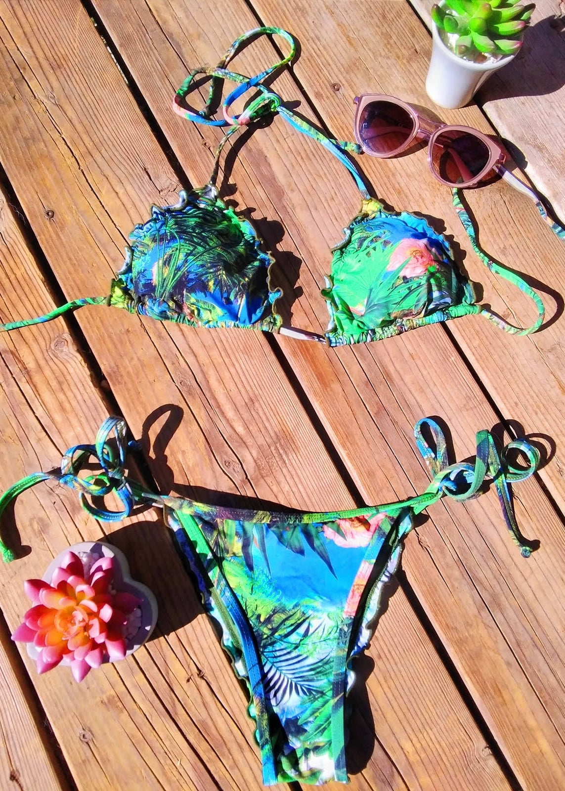 flat lay of the nature inspired baghira bikini - Jasikini swimwear